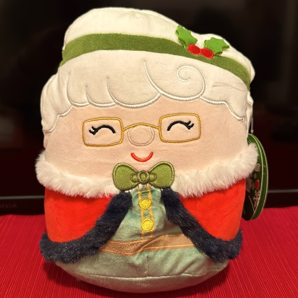 Squishmallows 8" Nicolette Claus in Red Cape w/green bow & mistletoe headband.